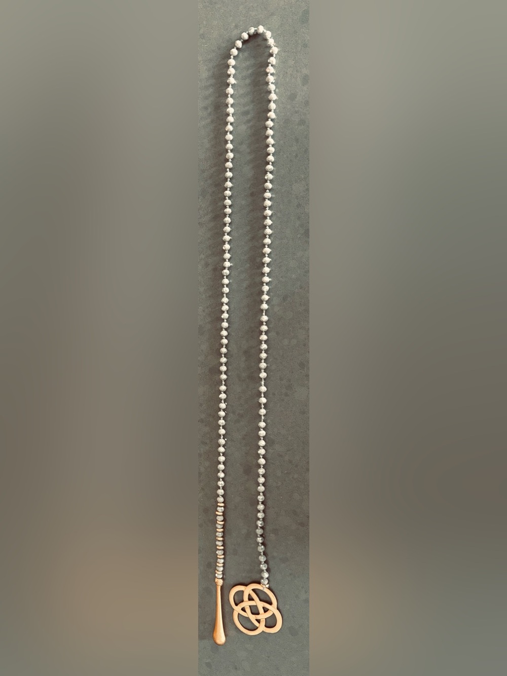 Silver Gray Beaded Lariat Style Necklace with Gold Detail Pendants